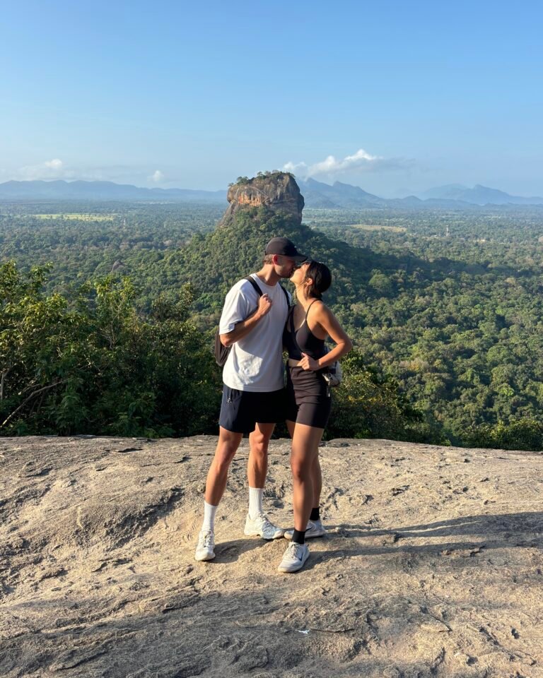 Couples photo with Lion's Rock, feature image for Sigiriya travel guide.
